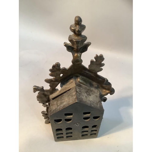 41 - A late Victorian cast iron money box modelled as a bear and bee hive
