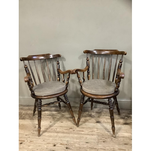 410 - Two Victorian polished beech spindle back armchairs on turned legs, later cushion seats