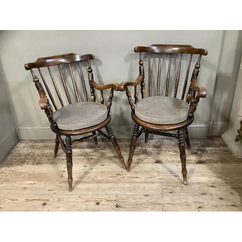 410 - Two Victorian polished beech spindle back armchairs on turned legs, later cushion seats