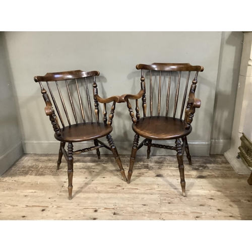 410 - Two Victorian polished beech spindle back armchairs on turned legs, later cushion seats