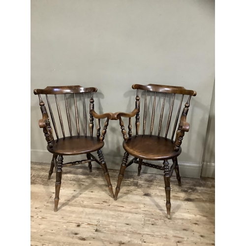 410 - Two Victorian polished beech spindle back armchairs on turned legs, later cushion seats