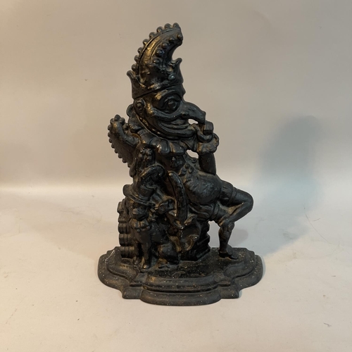 62 - A Victorian cast iron and black painted door stop in the form of punch, 32.5cm high