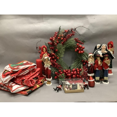 76 - Six resin carol singers, two singing nuns, a synthetic Christmas wreath with berries and other Chris... 