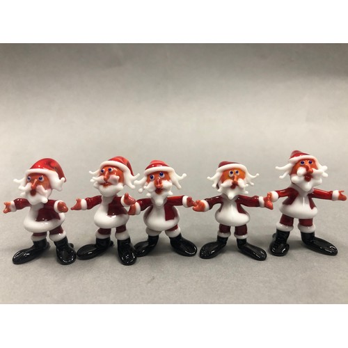 70 - Six Murano glass Santa figures with two skiing Santas with some damages