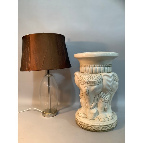 232 - A glass bodied table lamp with chrome mounts and shade together with a white ceramic garden seat for... 