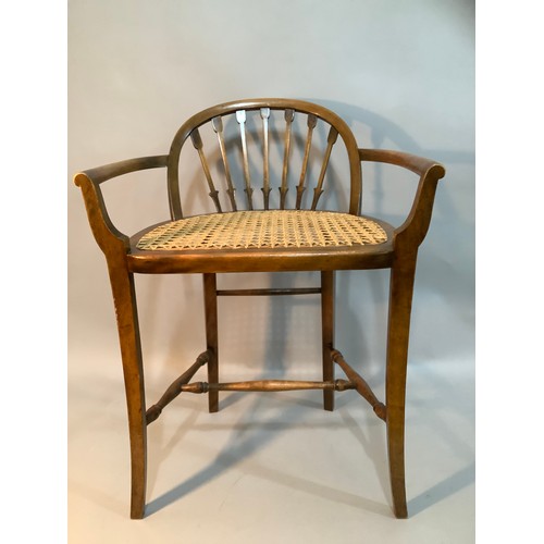 409 - A stained beech and begere caned low back chair on turned and square framing