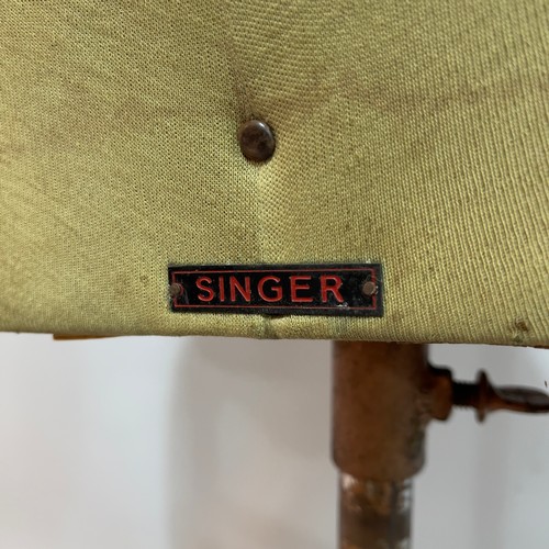 404 - A vintage Singer's tailors dummy on metal stand together with a hem measure