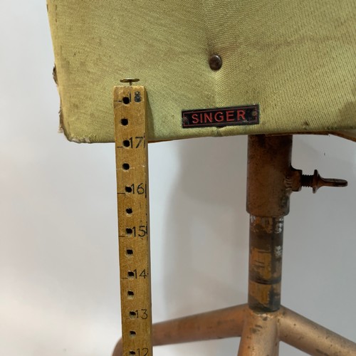 404 - A vintage Singer's tailors dummy on metal stand together with a hem measure