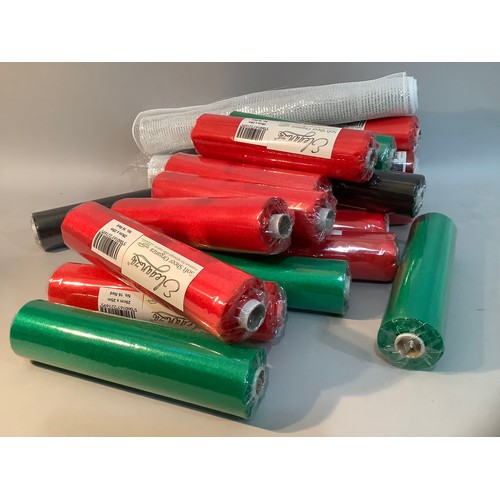 92 - A large quantity of rolls of red and green organza