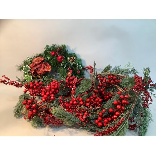 93 - A large faux foliage Christmas garland with berries and a Christmas wreath