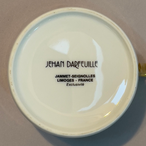 19 - A Limoges Jammet-Seignolles dinner service designed by Jehan Darfeuille, the rims glazed in gilt bor... 