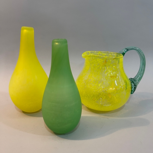 8 - Gunnel Sahlin for Kosta Boda, Swedish (b.1954), a green glass bottle shaped vase and another in yell... 