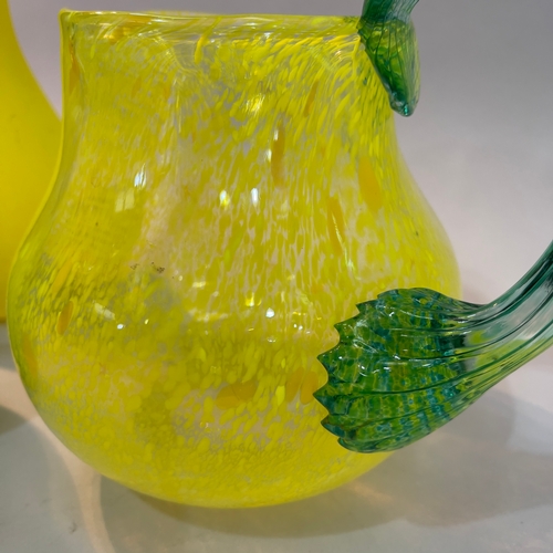 8 - Gunnel Sahlin for Kosta Boda, Swedish (b.1954), a green glass bottle shaped vase and another in yell... 