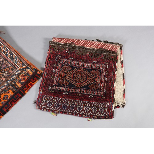 135 - Two Middle Eastern camel bags of fox red and diamond pattern and wine with panel medallion