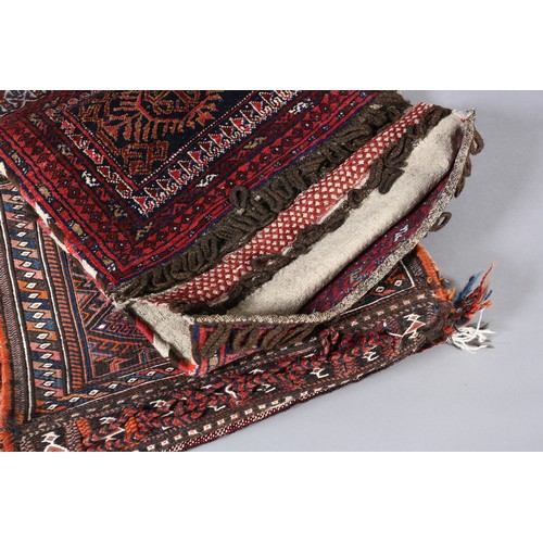 135 - Two Middle Eastern camel bags of fox red and diamond pattern and wine with panel medallion