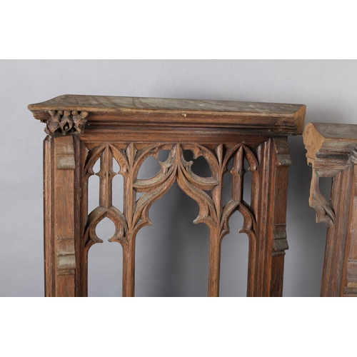 123 - Architectural Salvage: a pair of bleached oak front panels having a central arch with Gothic tracery... 