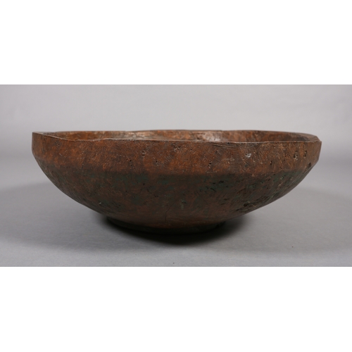 52 - A large rough-hewn carved hardwood bowl, 23cm high x 66.5cm diameter