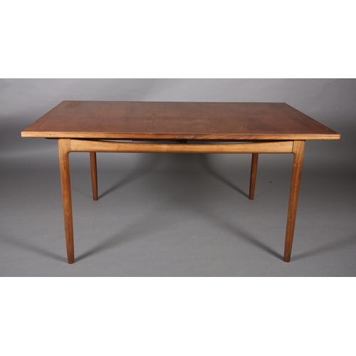 74 - A 1970's teak and walnut extending dining table, rectangular, on rounded and tapered legs, 89cm wide... 