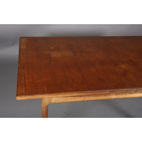 74 - A 1970's teak and walnut extending dining table, rectangular, on rounded and tapered legs, 89cm wide... 