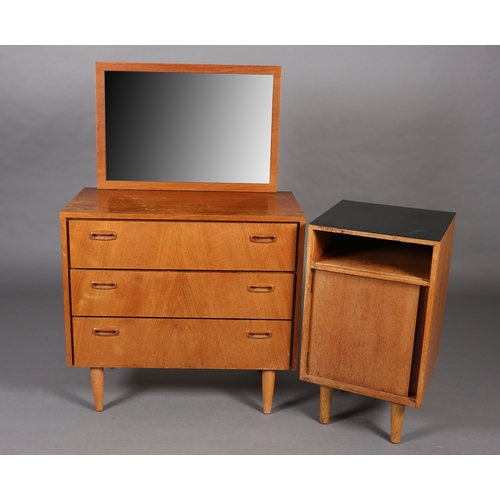 83 - A Stag teak and mirrored dressing chest of three drawers and a black Formica topped bedside cupboard... 