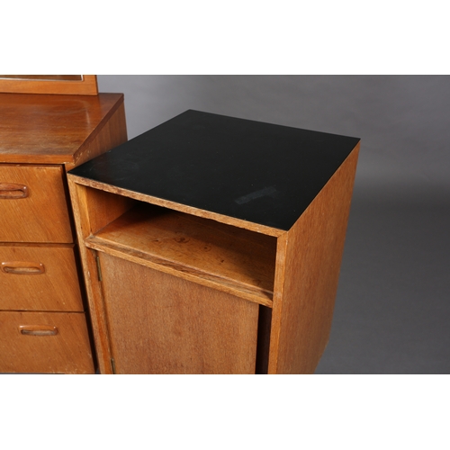 83 - A Stag teak and mirrored dressing chest of three drawers and a black Formica topped bedside cupboard... 