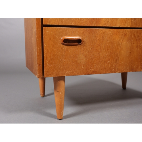 83 - A Stag teak and mirrored dressing chest of three drawers and a black Formica topped bedside cupboard... 