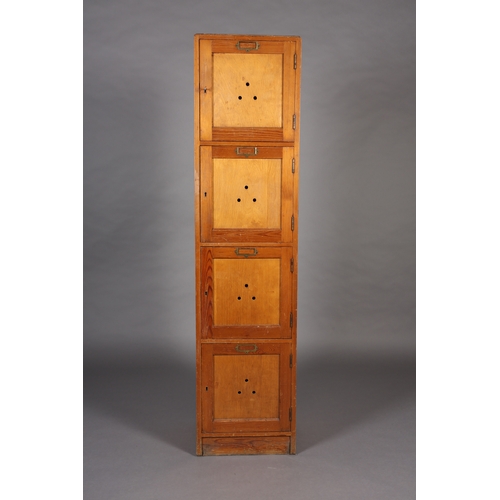 41 - A set of four vertical pine and plywood lockers mid 20th century each with brass window plate, on pl... 