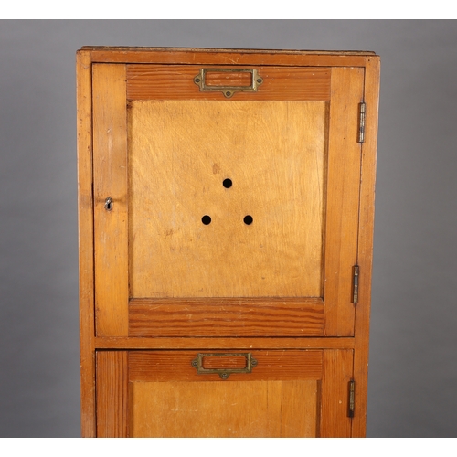 41 - A set of four vertical pine and plywood lockers mid 20th century each with brass window plate, on pl... 