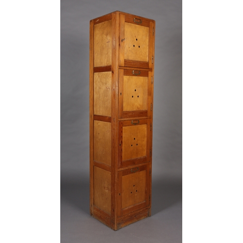 41 - A set of four vertical pine and plywood lockers mid 20th century each with brass window plate, on pl... 