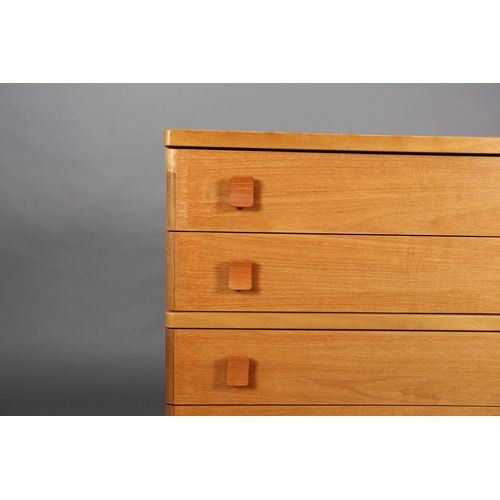 86 - A Stag teak chest c1980s, of five graduated drawers with curved handles on a plinth base, 82cm wide ... 