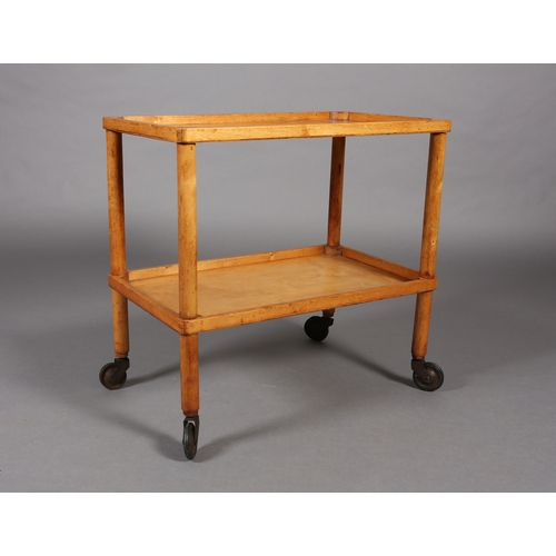 88 - A 1940s laminated birch two tier trolley on rounded uprights and rubber rimmed wheels 65cm wide x 39... 