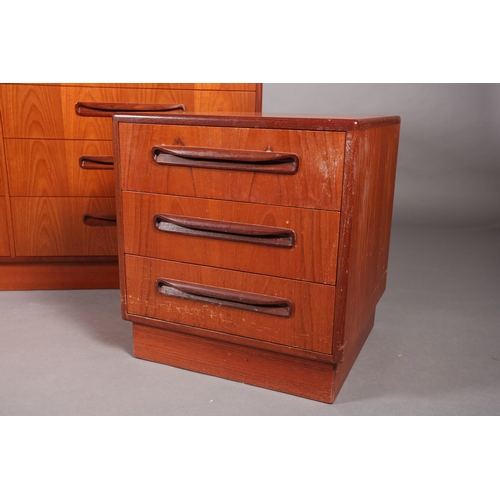 85 - A G-Plan teak chest of two banks of four drawers with curved linear handles on recessed plinth base,... 