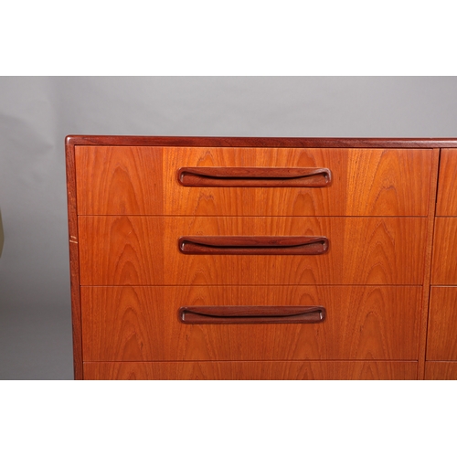 85 - A G-Plan teak chest of two banks of four drawers with curved linear handles on recessed plinth base,... 