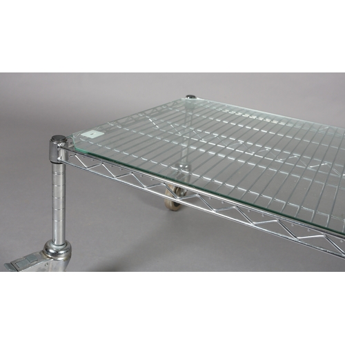 90 - An InterMetro Louis Maslow Metropolitan Wire Goods steel and glass coffee table, rectangular on lock... 