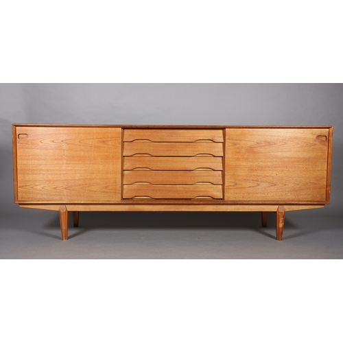 27 - Drylund, Denmark c. early 1970s, a teak sideboard having five drawers to the centre flanked by a sli... 