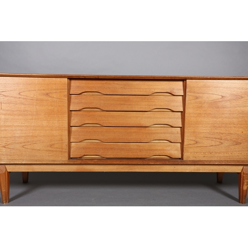 27 - Drylund, Denmark c. early 1970s, a teak sideboard having five drawers to the centre flanked by a sli... 