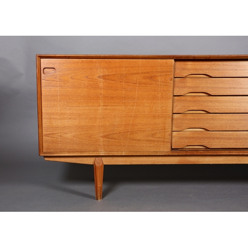 27 - Drylund, Denmark c. early 1970s, a teak sideboard having five drawers to the centre flanked by a sli... 