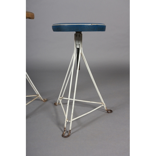 30 - A pair of 1960s white iron revolving stools on triangular frame with PVC upholstered seat