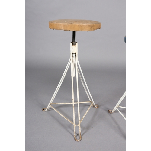 30 - A pair of 1960s white iron revolving stools on triangular frame with PVC upholstered seat