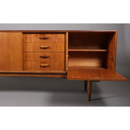 76 - A G Plan 'Brasilia' teak sideboard having a two door cupboard, four drawers and a drop front cupboar... 