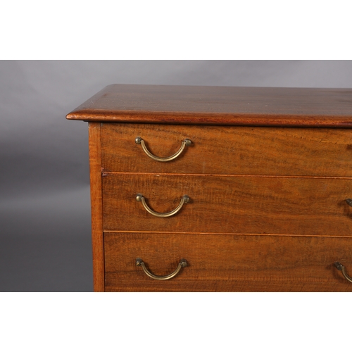 114 - Alfred Cox, A walnut sideboard 1950s having four graduated drawers with gilt metal swing handles fla... 