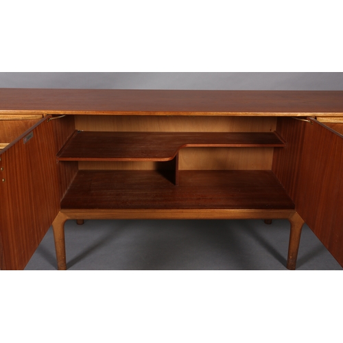 40 - A Maclntosh teak 'Dunfermline' sideboard, late 1960s/70s having a two door cupboard to the centre fl... 