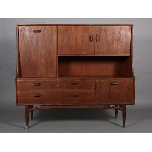 87 - A G-Plan teak cabinet circa late 1960's, having a drop front, two door cupboard above an open compar... 