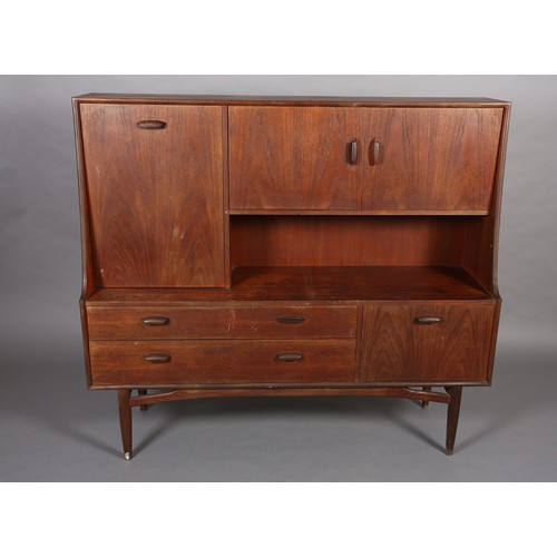 87 - A G-Plan teak cabinet circa late 1960's, having a drop front, two door cupboard above an open compar... 