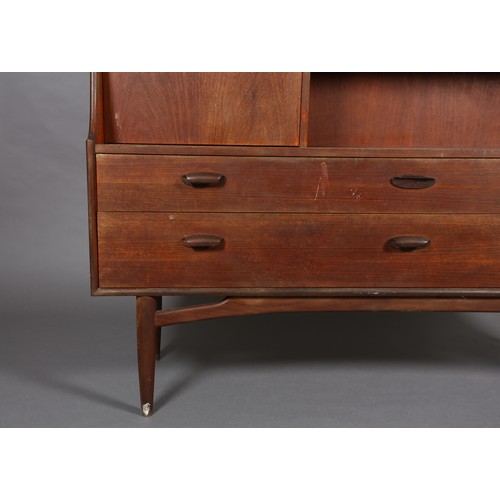 87 - A G-Plan teak cabinet circa late 1960's, having a drop front, two door cupboard above an open compar... 