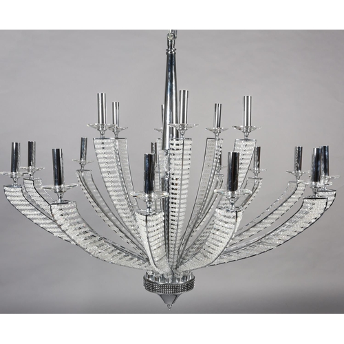 63 - A two tier white metal chandelier of eighteen lights, radiating from a central column, each arm stru... 