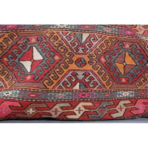 108 - A large flatweave camel bag of geometric design in orange, pink, brown and camel, 95cm x 60cm