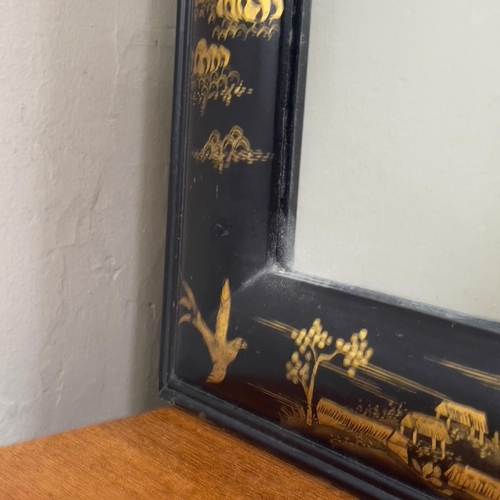 110 - A black lacquered and gilt chinoiserie wall mirror, rectangular, 64cm x 83cm