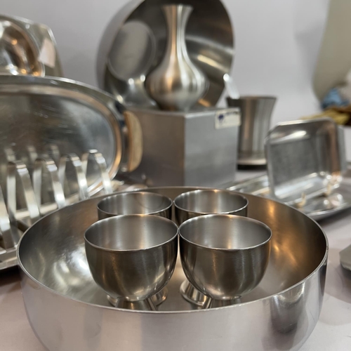 69 - A quantity of stainless steel table ware c1970s, Danish and Old Hall including cruets, bowl, toast r... 