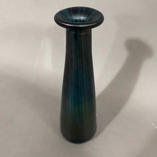 56 - John Ditchfield (b. 19520
An aquamarine and blue iridescent glass vase of tapered form with everted ... 